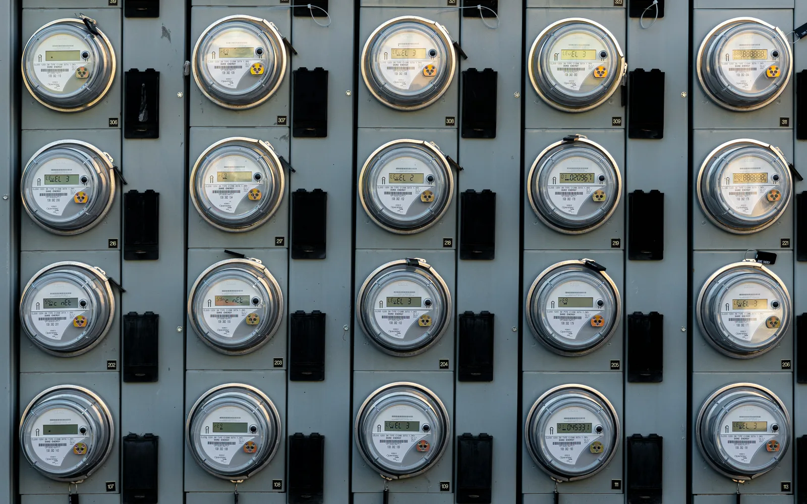 Rows of electricity meters on a wall