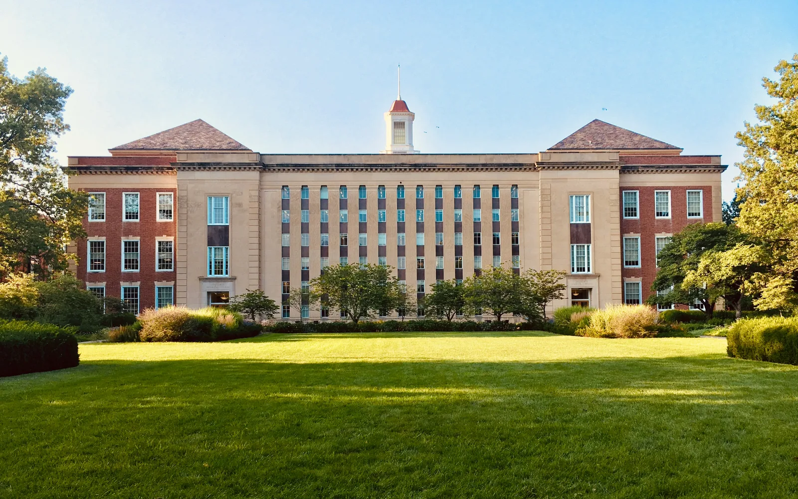 University building across a green lawn
