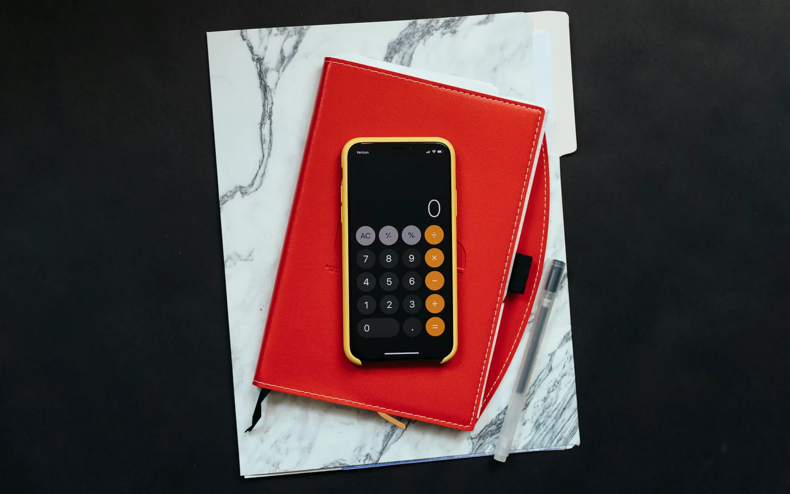 black Android smartphone on red flip case