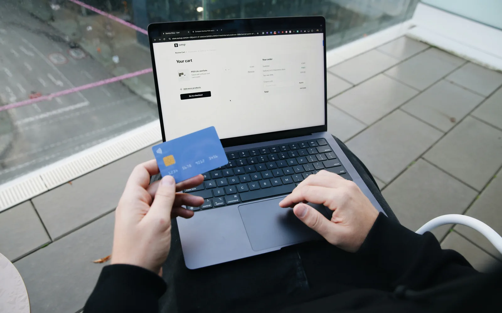 Paying online with a card on a laptop