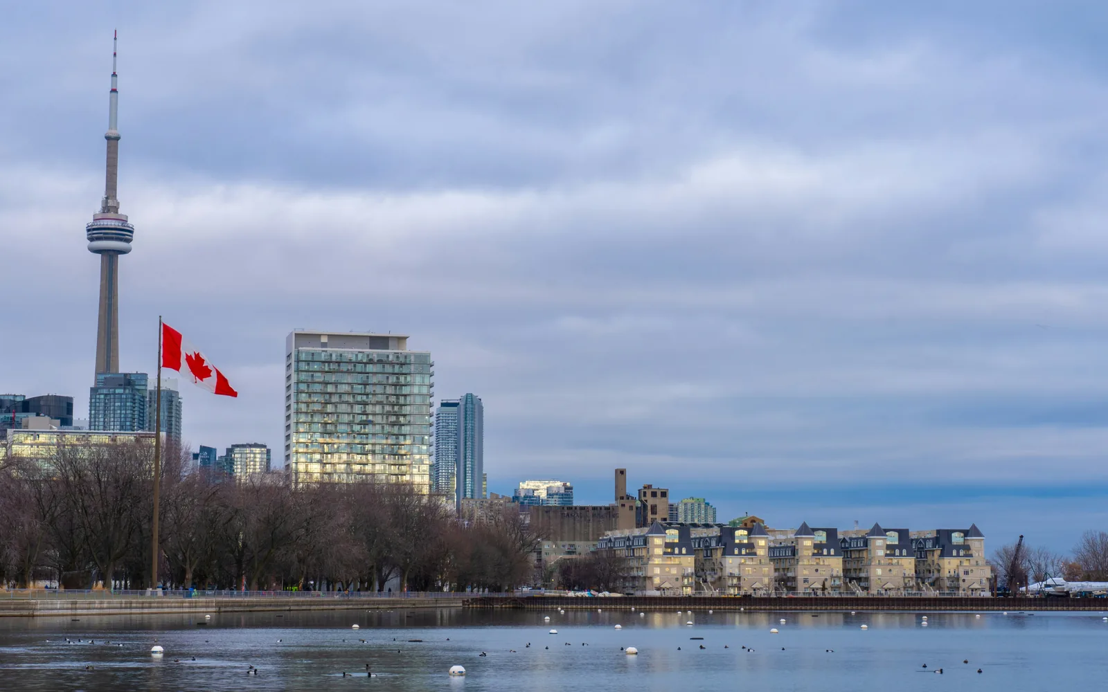 city skyline under cloudy sky during daytime