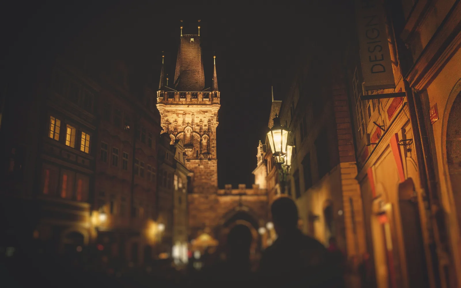 people standing near brown concrete tower