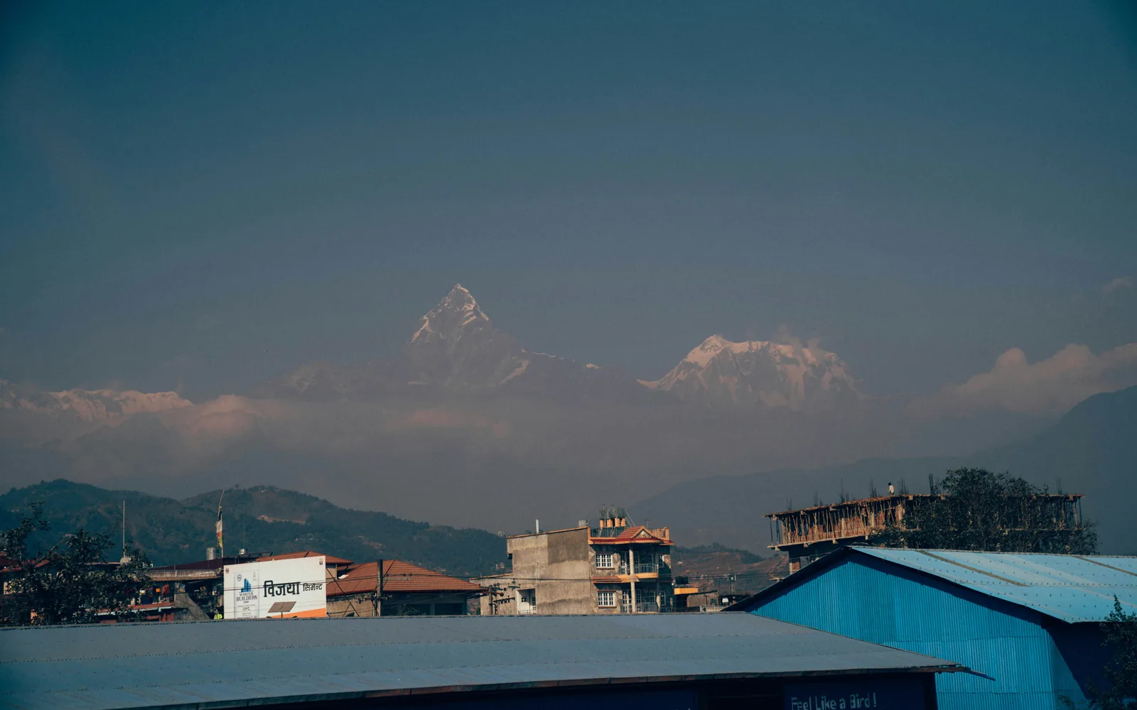 houses near mountain during daytime