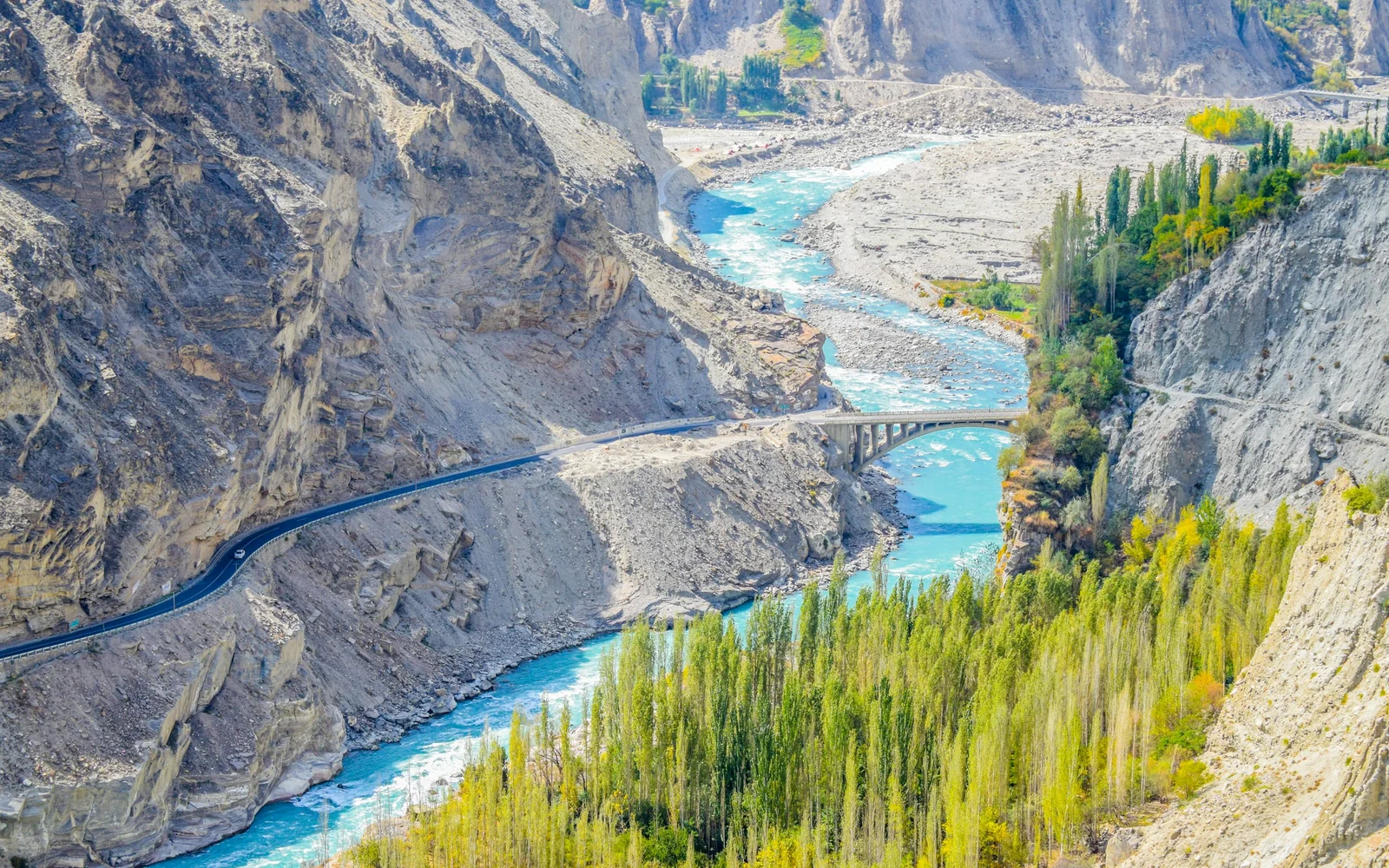 Aerial view of a river winding through the mountains of Hunza Valley, Pakistan