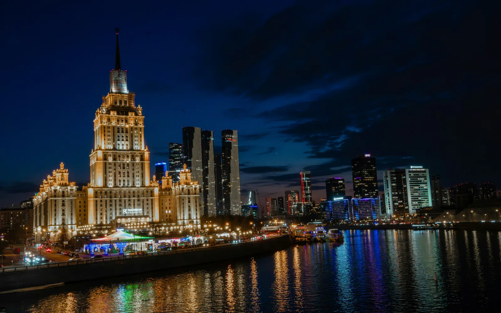 City skyline with illuminated buildings at night